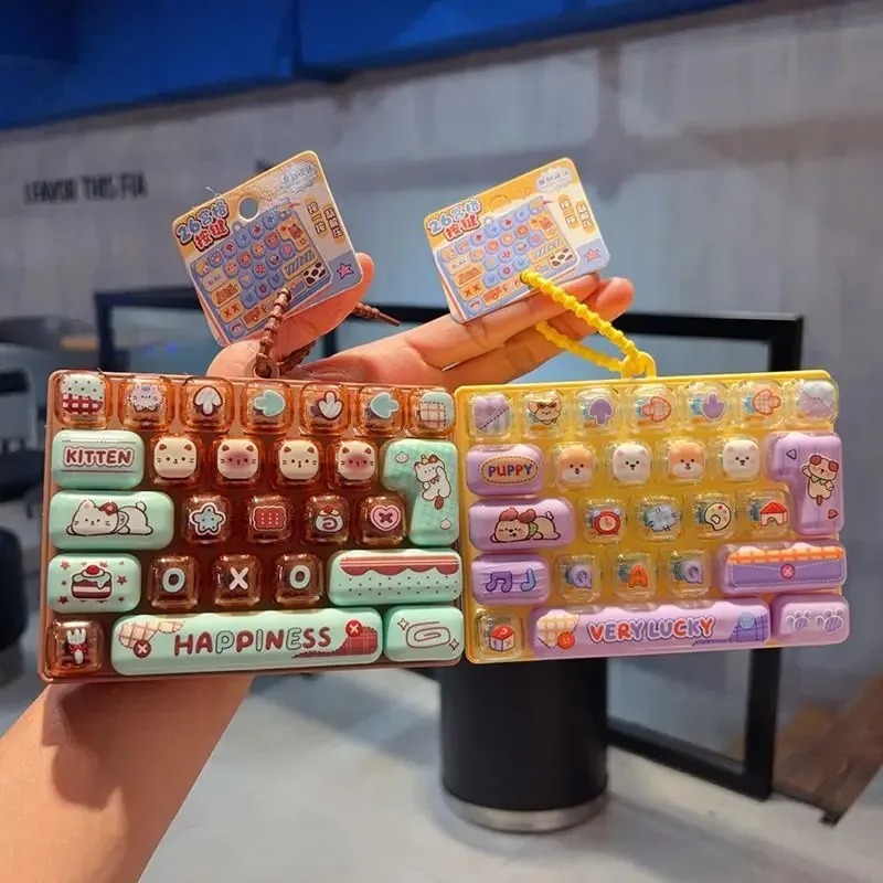 Party Games Switch - Auf Lager 26-Gitter-Tastenkappen-Clicker Anti-Stress Fidget-Tastatur-Schlüsselanhänger Entspannungsknopf