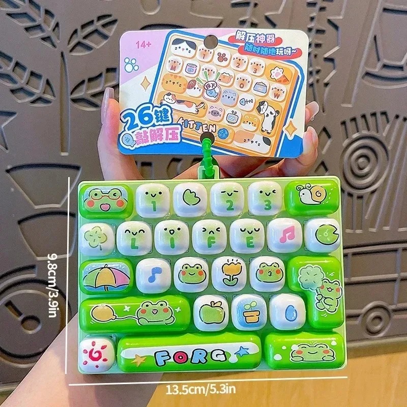 Party Games Switch - 26-Gitter-Tastenkappen-Clicker / Anti-Stress-Fidget-Tastatur-Schlüsselanhänger Entspannungsknopf Cartoon-Handentspannung Partygeschenk